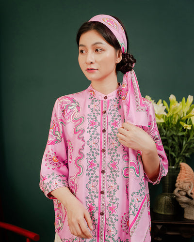 Pink Phoenix Dance silk scarf tied as a headband, the long ends falling over the shoulder