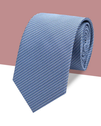 Rolled light blue silk jacquard tie with a fine woven texture
