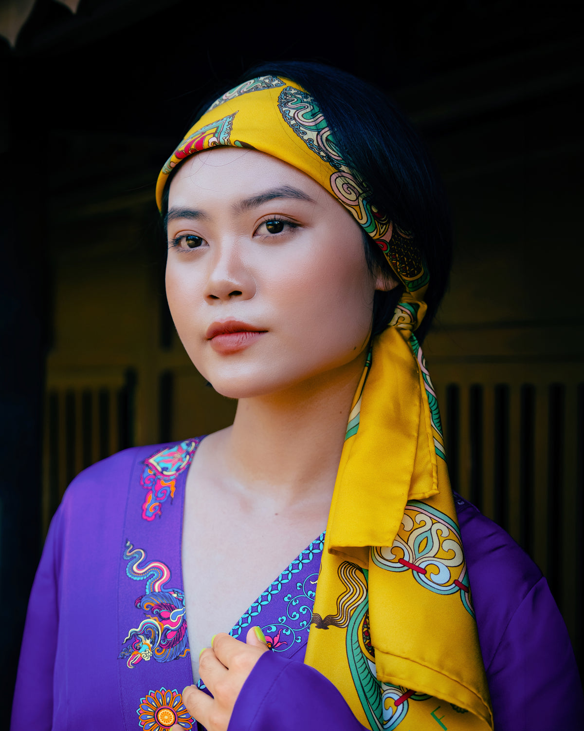 Close view of the hand-printed trim on the violet silk kimono dress neckline