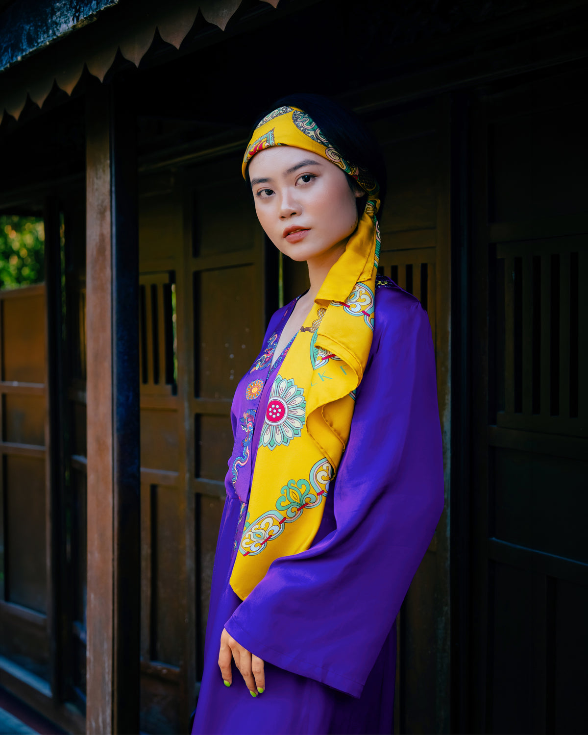 Violet silk wrap dress with hand-printed border, side view