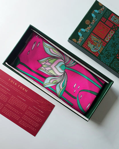 Folk Form heritage green gift box with hot pink Imperial Lotus silk, red care card and printed lid
